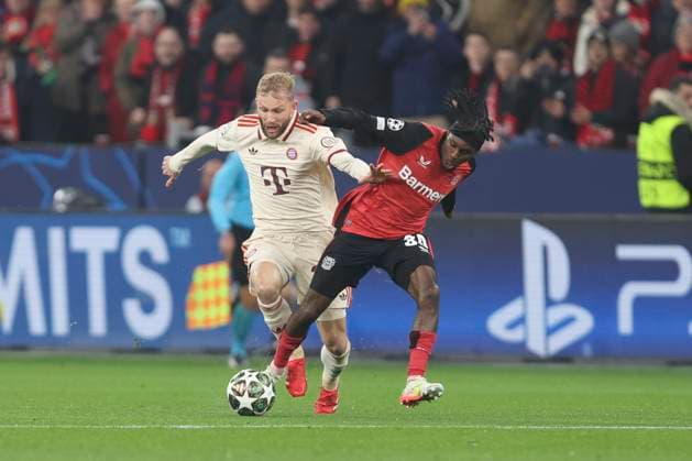 Konrad Laimer FC Bayern München and Jeremie Frimpong Bayer 04 Leverkusen battle for the ball during the UEFA Champions League 2024 25 Round of 16 Second Leg match between Bayer 04 Leverkusen and FC Bayern München at BayArena on March 11, 2025 in Leverkusen, Germany Photo by Oliver Kaelke DeFodi Images