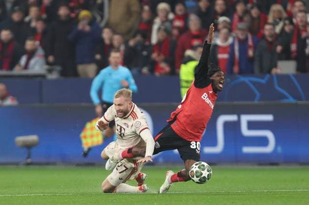 Konrad Laimer FC Bayern München and Jeremie Frimpong Bayer 04 Leverkusen battle for the ball during the UEFA Champions League 2024 25 Round of 16 Second Leg match between Bayer 04 Leverkusen and FC Bayern München at BayArena on March 11, 2025 in Leverkusen, Germany Photo by Oliver Kaelke DeFodi Images