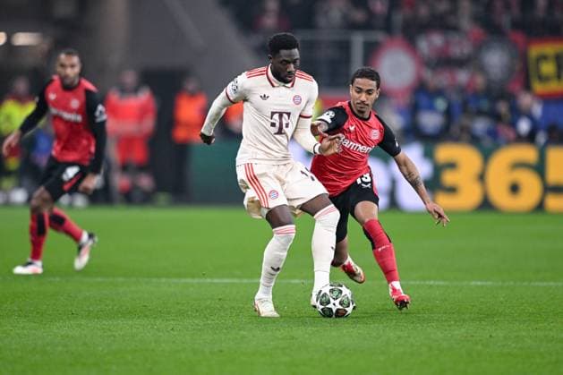11 03 2025, Football UEFA Champions League 2024 2025, Round of 16, Bayer 04 Leverkusen FC Bayern München, in the BayArena, Kingsley Coman FC Bayern München , Arthur Bayer Leverkusen DFL and DFB regulations prohibit any use of photographs as image sequences and or quasi video