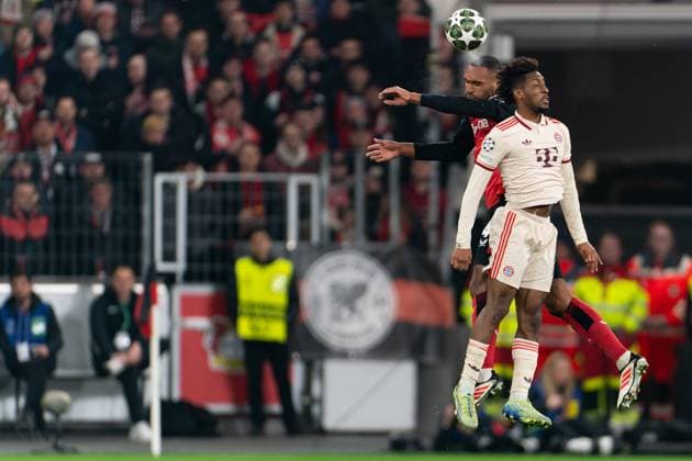 2025-03-11 Bayer 04 Leverkusen v FC Bayern Munchen - UEFA Champions League 2024 25 Round of 16 Second Leg LEVERKUSEN, GERMANY - MARCH 11: Jonathan Tah of Bayer 04 Leverkusen battles for the ball with Kingsley Coman of FC Bayern Munchen during the UEFA Champions League 2024 25 Round of 16 Second Leg match between Bayer 04 Leverkusen and FC Bayern Munchen at BayArena on March 11, 2025 in Leverkusen, Germany. Leverkusen BayArena Germany Content not available for redistribution in The Netherlands directly or indirectly through any third parties. Copyright: xJorisxVerwijstx