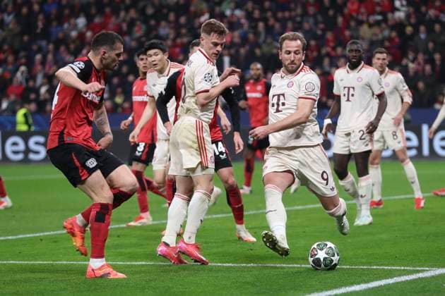 Granit Xhaka Bayer 04 Leverkusen , Joshua Kimmich FC Bayern München and Harry Kane FC Bayern München battle for the ball during the UEFA Champions League 2024 25 Round of 16 Second Leg match between Bayer 04 Leverkusen and FC Bayern München at BayArena on March 11, 2025 in Leverkusen, Germany Photo by Oliver Kaelke DeFodi Images
