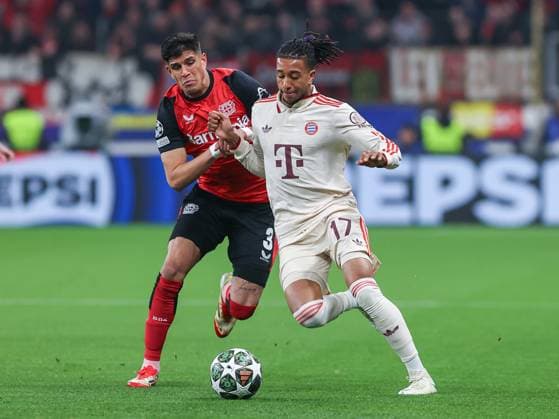 March 11, 2025, Leverkusen, Nrw, Germany: PIERO HINCAPIE REINA (Bayer 04 Leverkusen, 03) and MICHAEL AKPOVIE OLISE (Bayern MoÂ¼nchen, 17) fights for ball, during the UEFA Champions League round of 16, 2nd leg match between Bayer 04 Leverkusen and Bayern MoÂ¼nchen at the BayArena Stadium. Leverkusen Germany - ZUMAb275 20250311_zsp_b275_008 Copyright: xGabrielxBoiax