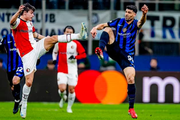 Feyenoord Rotterdam defender Hugo Bueno, FC Internazionale Milan forwarder Mehdi Taremi during the match Inter Feyenoord at the San Siro Stadium for the UEFA Champions League Round of 16 2st leg season 2024 2025 in MILAN, Italia on 11 march 2025, photo by Marcel van Dorst EYE4images DeFodi Images