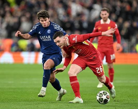 Liverpool, England, 11th March 2025. Andrew Robertson of Liverpool with Joao Neves of Paris St Germain during the UEFA Champions League match Liverpool vs Paris Saint Germain at Anfield, Liverpool. Picture credit should read: Cody Froggatt Sportimage EDITORIAL USE ONLY. No use with unauthorised audio, video, data, fixture lists, club league logos or live services. Online in-match use limited to 120 images, no video emulation. No use in betting, games or single club league player publications. SPI_CF_042_Man_City_Real_Madrid SPI-3739-0042