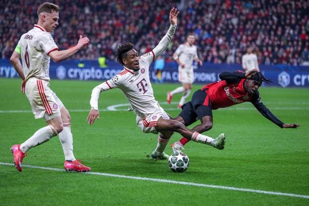 11 03 2025, Football, UEFA Champions League, Bayer 04 Leverkusen FC Bayern München, Round of 16 second leg, BayArena, Season 2024 2025 Kingsley Coman FC Bayern 11 in duel against Jeremie Frimpong Bayer04 Leverkusen 30 DFB regulations prohibit any use of photographs as image sequences and or quasi video Nordrhein Westfalen Germany