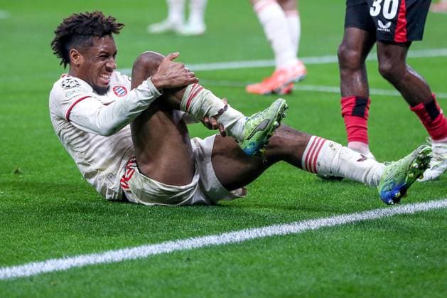 11 03 2025, Football, UEFA Champions League, Bayer 04 Leverkusen FC Bayern München, Round of 16 second leg, BayArena, Season 2024 2025 Kingsley Coman FC Bayern 11 lies in pain on the pitch DFB regulations prohibit any use of photographs as image sequences and or quasi video Nordrhein Westfalen Germany