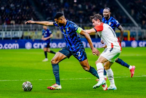FC Internazionale Milan defender Denzel Dumfries, Feyenoord Rotterdam defender Hugo Bueno during the match Inter Feyenoord at the San Siro Stadium for the UEFA Champions League Round of 16 2st leg season 2024 2025 in MILAN, Italia on 11 march 2025, photo by Marcel van Dorst EYE4images DeFodi Images