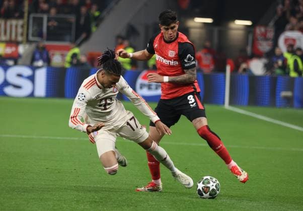 Michael Olise Bayern, L and Piero Martin Hincapie Reyna Bayer , Champions League, Round of 16 second leg, Bayer 04 Leverkusen vs FC Bayern Munich, Leverkusen, Germany, 11 03 2025
