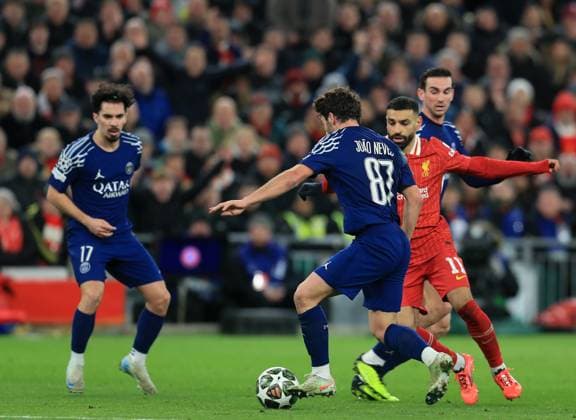 11th March 2025; Anfield, Liverpool, Merseyside, England; Champions League Last 16, Second Leg Football, Liverpool versus Paris Saint Germain; Mohammed Salah of Liverpool is tackled by Joao Neves of Paris St Germain  ActionPlus12758902 DavidxBlunsden