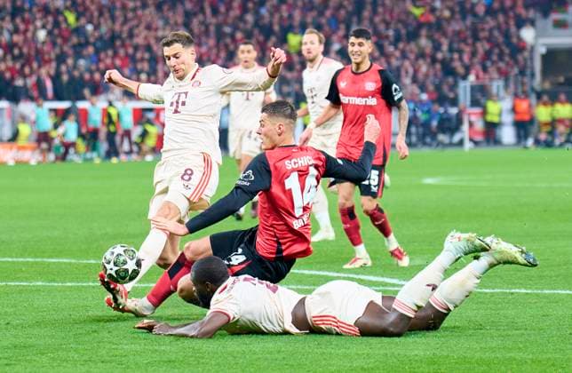 Leon GORETZKA, FCB 8 Dayot Upamecano , FCB 2 compete for the ball, tackling, duel, header, zweikampf, action, fight against Patrik Schick, Lev 14 in the round of 16 second leg match BAYER 04 LEVERKUSEN - FC BAYERN MUENCHEN of football UEFA Champions League in season 2024 2025 in Leverkusen, Mar 11, 2025 , FCB, x.Spieltag, München