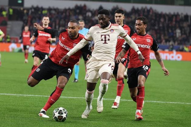 Jonathan Tah Bayer 04 Leverkusen and Alphonso Davies FC Bayern Munich in the round of 16 second leg of the 2024 UEFA Champions League season 25 Bayer Leverkusen FC Bayern Munich Copyright Thomas Pakusch Copyright: Thomas Pakusch