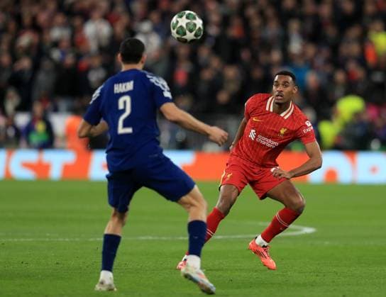 11th March 2025; Anfield, Liverpool, Merseyside, England; Champions League Last 16, Second Leg Football, Liverpool versus Paris Saint Germain; Ryan Gravenberch of Liverpool challenges Achraf Hakimi of Paris Saint Germain  ActionPlus12758926 DavidxBlunsden