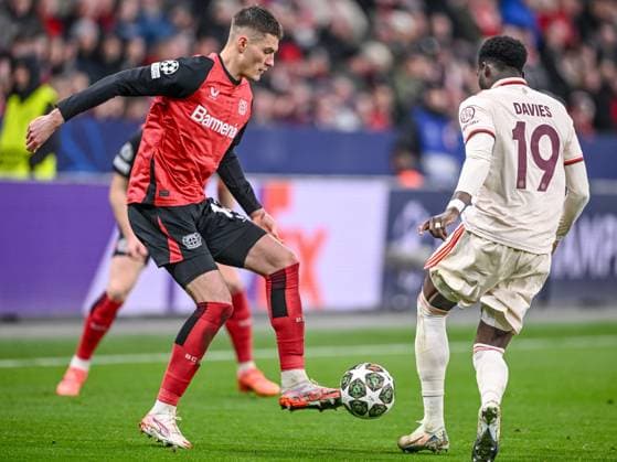 Leverkusen, Germany, 11 03 2025 Patrick Schick Bayer 04 Leverkusen and Alphonso Davies FC Bayern Muenchen battle for the ball during the UEFA Champions League 2024 25 Round of 16 Second Leg match between Bayer 04 Leverkusen and FC Bayern München at BayArena on March 11, 2025 in Leverkusen, Germany Photo by Harry Langer DeFodi Images