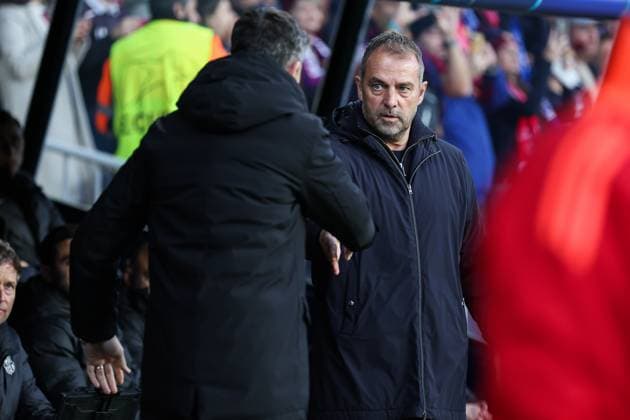 March 11, 2025, Barcelona, Barcelona, SPAIN: Bruno Lage head coach of SL Benfica and Hansi Flick, head coach of FC Barcelona, Barca greet each other during the UEFA Champions League 2024 25 Round of 16 second leg, match between FC Barcelona and SL Benfica at Estadi Olimpic Lluis Companys March 11, 2025 in Barcelona, Spain. Barcelona SPAIN - ZUMAa181 20250311_zaa_a181_203 Copyright: xIrinaxR.Hx