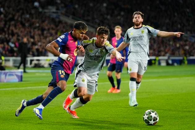 FC Barcelona, Barca v SL Benfica - UEFA Champions League 2024 25 Round of 16 Second Leg Lamine Yamal right winger of Barcelona and Spain and Samuel Dahl left-back of Benfica of Sweden compete for the ball during the UEFA Champions League 2024 25 Round of 16 Second Leg match between FC Barcelona and SL Benfica at Estadi Olimpic Lluis Companys on March 11, 2025 in Barcelona, Spain. Barcelona Spain  Copyright: xJosexBretonx originalFilename:bretonhernandez-fcbarcel250311_nppmu.jpg