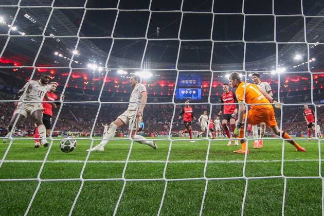 UEFA Champions League Bayer 04 Leverkusen FC Bayern Munich on 11 03 2025 at BayArena in Leverkusen Harry Kane Muenchen 9 scores against goalkeeper Lukas Hradecky Leverkusen 1 to make it 0 - 1 MH