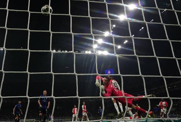 (250312) -- MILAN, March 12, 2025 -- Feyenoord s goalkeeper Timon Wellenreuther (front) fails to save Inter Milan s Marcus Thuram s goal during the round of 16 second leg match of UEFA Champions League between Inter Milan and Feyenoord in Milan, Italy, March 11, 2025. (Photo by Xinhua) (SP)ITALY-MILAN-FOOTBALL-UEFA CHAMPIONS LEAGUE-INTER MILAN VS FEYENOORD AlbertoxLingria 