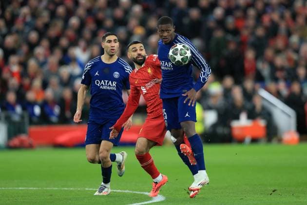 11th March 2025; Anfield, Liverpool, Merseyside, England; Champions League Last 16, Second Leg Football, Liverpool versus Paris Saint Germain; Mohammed Salah of Liverpool competes for the ball with Nuno Mendes of Paris Saint Germain  ActionPlus12759050 DavidxBlunsden