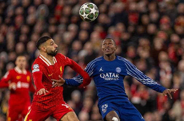 (250312) -- LIVERPOOL, March 12, 2025 -- Liverpool s Mohamed Salah (L) is challenged by Paris Saint-Germain s Nuno Mendes during the UEFA Champions League Round of 16 2nd Leg match between Liverpool FC and Paris Saint-Germain FC in Liverpool, Britain, on March 11, 2025. (SP)BRITAIN-LIVERPOOL-FOOTBALL-UEFA CHAMPIONS LEAGUE-LIVERPOOL FC VS PSG LixYing 