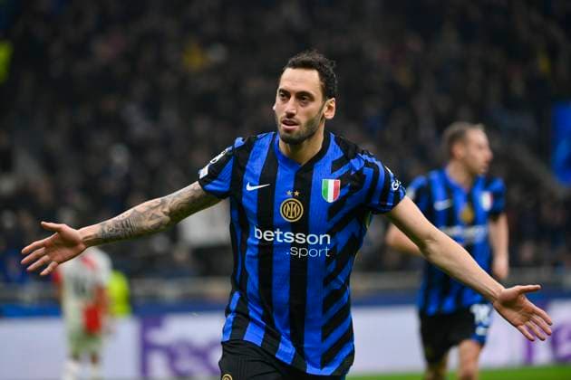11th March 2025; Stadio San Siro, Milan, Italy, Champions League Football, Last 16, Second Leg, Inter Milan versus Feyenoord; Hakan Calhanoglu of FC Internazionale celebrates his goal from a penalty kick for 2-1 in the 51st minute  ActionPlus12759162 BestxImages