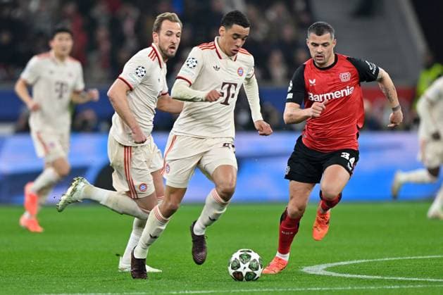 (250312) -- LEVERKUSEN, March 12, 2025 -- Jamal Musiala (C) of Bayern Munich breaks through during the UEFA Champions League Round of 16 2nd leg football match between Bayer 04 Leverkusen and Bayern Munich in Leverkusen, Germany, March 11, 2025. (Photo by Xinhua) (SP)GERMANY-LEVERKUSEN-FOOTBALL-UEFA CHAMPIONS LEAGUE-LEVERKUSEN VS BAYERN MUNICH UlrichxHufnagel 