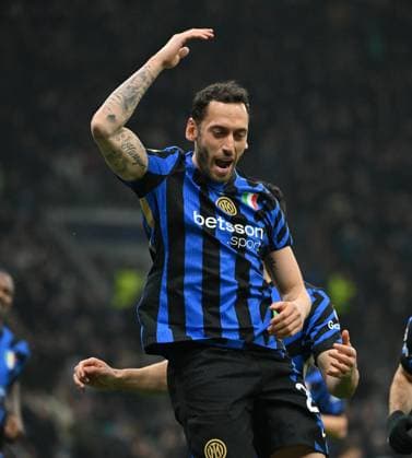(250312) -- MILAN, March 12, 2025 -- Inter Milan s Hakan Calhanoglu celebrates his goal during the round of 16 second leg match of UEFA Champions League between Inter Milan and Feyenoord in Milan, Italy, March 11, 2025. (Photo by Xinhua) (SP)ITALY-MILAN-FOOTBALL-UEFA CHAMPIONS LEAGUE-INTER MILAN VS FEYENOORD AlbertoxLingria 