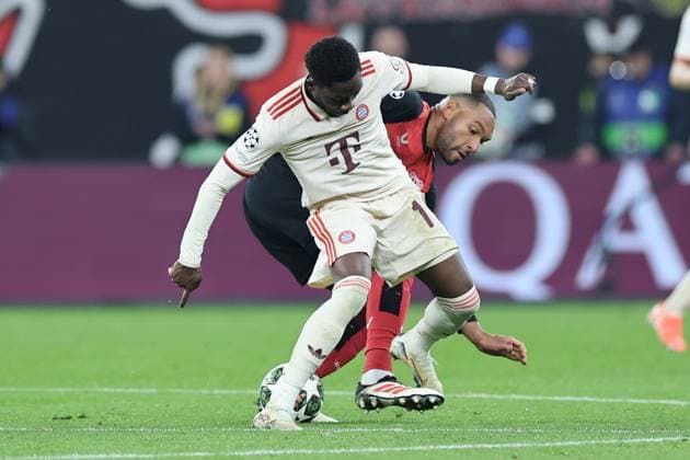 GER, UEFA CL, Round of 16 second leg, Bayer 04 Leverkusen GER vs Bayern Muenchen GER , 11 03 2025, BayArena, Leverkusen, GER, UEFA CL, Round of 16 second leg, Bayer 04 Leverkusen GER vs Bayern Muenchen GER , , in picture Alphonso Davies Bayern Muenchen 19 , in duel against Jonathan Tah Leverkusen 4 , nordphotoxGmbHx xMeuter nph00351