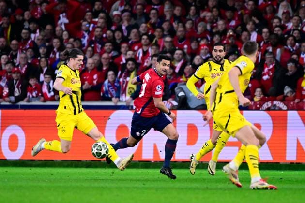 FOOTBALL : Lille vs Borussia Dortmund - Ligue des Champions - 12 03 2025 Benjamin Andre ( 21 - Lille ) , Emre Can ( 23 - Borussia Dortmund ) and Marcel Sabitzer ( 20 - Borussia Dortmund ) during UEFA Champions League match between Lille OSC and Borussia Dortmund at Stade Pierre Mauroy on March 12, 2025 in Lille, France. ( Photo by Dante Badano PsnewZ ) - LilleFrance  Copyright: xDantexBadanox