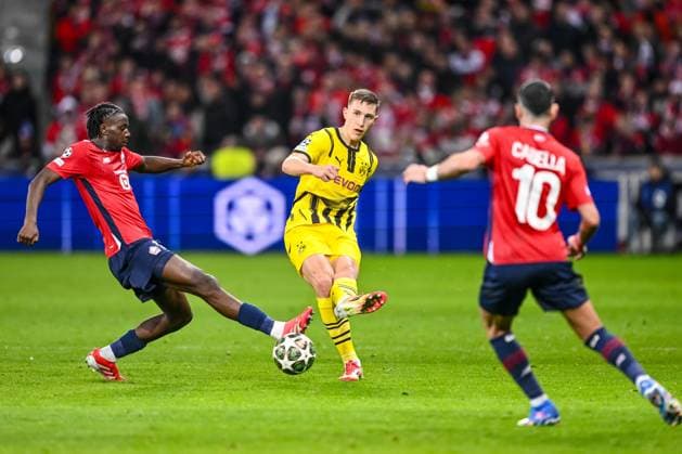 Lille, France, 12 03 2025 NgalÃÄyel Mukau LOSC Lille , Nico Schlotterbeck BV Borussia Dortmund and Remy Cabella LOSC Lille battle for the ball during the UEFA Champions League 2024 25 Round of 16 Second Leg match between LOSC Lille and Borussia Dortmund at Stade Pierre Mauroy on March 12, 2025 in Lille, France Photo by Harry Langer DeFodi Images