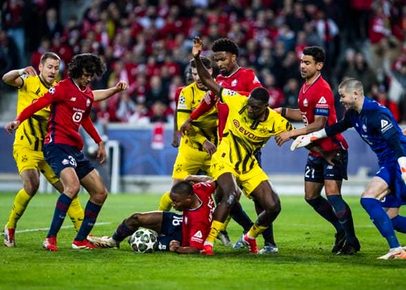 Lille, Stade Pierre Mauroy, 12 03 2025 Bafode Diakite of Lille challenges Serhou Guirassy of Dortmund during the match of the Championsleague Round 16 between Lille OSC v Borussia Dortmund