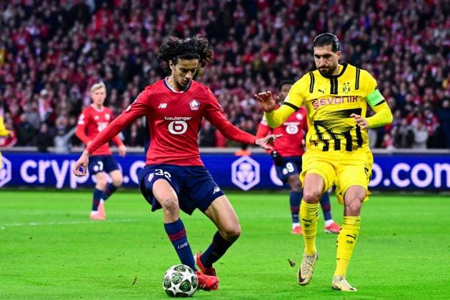 FOOTBALL : Lille vs Borussia Dortmund - Ligue des Champions - 12 03 2025 Ayyoub BOUADDI ( 32 - Lille ) and Emre Can ( 23 - Borussia Dortmund ) during UEFA Champions League match between Lille OSC and Borussia Dortmund at Stade Pierre Mauroy on March 12, 2025 in Lille, France. ( Photo by Dante Badano PsnewZ ) - LilleFrance  Copyright: xDantexBadanox
