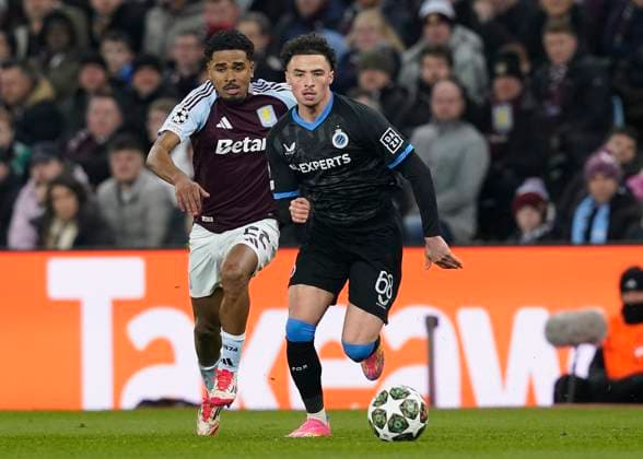 Birmingham, England, 12th March 2025. Ian Maatsen of Aston Villa and Chemsdine Talbi of Club Brugge challenge for the ball during the UEFA Champions League match Aston Villa v Club Brugge at Villa Park, Birmingham. Picture credit should read: Andrew Yates Sportimage EDITORIAL USE ONLY. No use with unauthorised audio, video, data, fixture lists, club league logos or live services. Online in-match use limited to 120 images, no video emulation. No use in betting, games or single club league player publications. SPI_021_AY_Villa_Brugge SPI-3740-0021