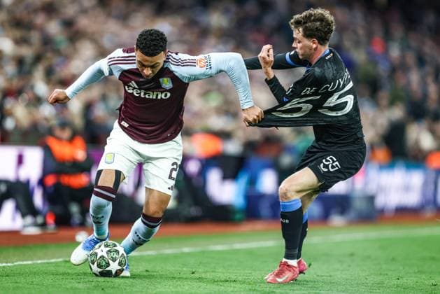 Aston Villa s Morgan Rogers and Club s Maxim De Cuyper fight for the ball during a game between English club Aston Villa and Belgian soccer Club Brugge KV, Wednesday 12 March 2025 in Birmingham, United Kingdom, the second leg of the 1 8 finals of the UEFA Champions League knockout phase. BRUNOxFAHY  x114811823x
