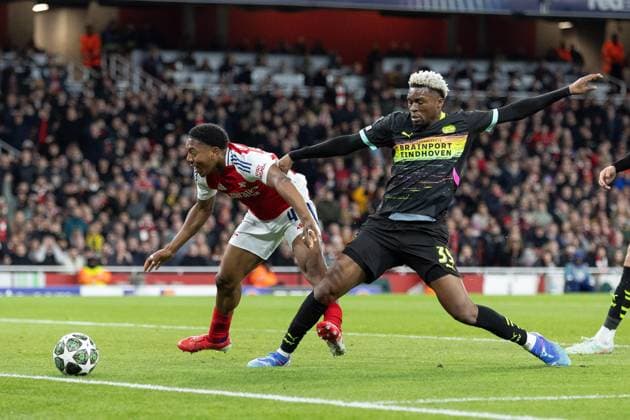 12th March 2025; Emirates Stadium, London, England; UEFA Champions League Last 16, Second Leg Football, Arsenal versus PSV Eindhoven; Myles Lewis-Skelly of Arsenal appears to be pushed by Adamo Nagalo of PSV Eindhoven  ActionPlus12759362 IanxStephen