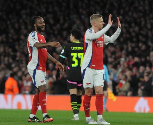 Football - 2024 2025 UEFA Champions League - Round of Sixteen - Second Leg - Arsenal vs PSV Eindhoven - Emirates Stadium - Wednesday 12th March 2025 Oleksandr Zinchenko of Arsenal celebrates scoring goal no 1 with Raheem Sterling 