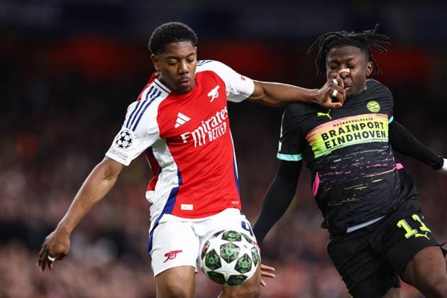 Arsenal gegen PSV Eindhoven 12. März 2025, London UEFA Champions League Achtelfinal-Rückspiel Arsenal gegen PSV Eindhoven Myles Lewis Skelly von Arsenal und Johan Bakayoko von PSV Eindhoven Foto Jacques Feeney Offside London UK  Copyright: xJacquesxFeeneyx xOffsidexOffside