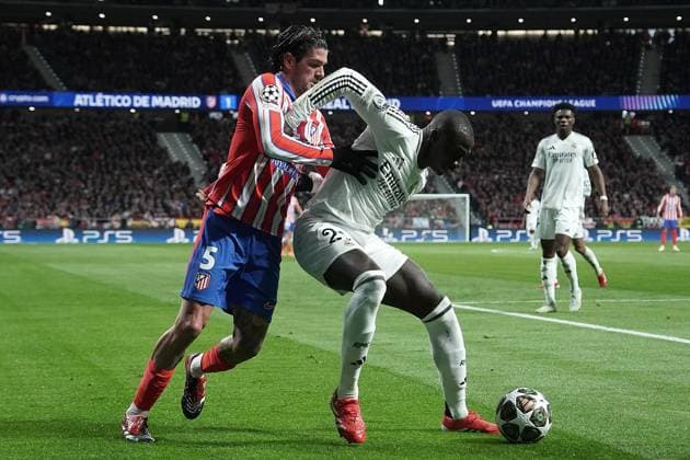 Atletico de Madrid s Rodrigo de Paul (l) and Real Madrid CF s Ferland Mendy during Champions League 2024 2025 Round of 16 2nd leg match. March 12,2025. (2025031256)