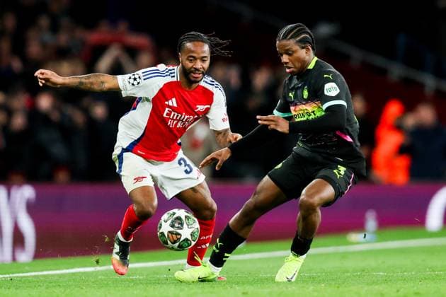 Raheem Sterling of Arsenal & Tyrell Malacia of PSV Eindhoven Arsenal v PSV Eindhoven, UEFA Champions League, Round of 16, Second Leg, Football, Emirates Stadium, London, UK - 12 Mar 2025 EDITORIAL USE ONLY No use with unauthorised audio, video, data, fixture lists, club league logos or live services. Online in-match use limited to 120 images, no video emulation. No use in betting, games or single club league player publications. Copyright: xAndrewxFosker Shutterstockx 15188185bm