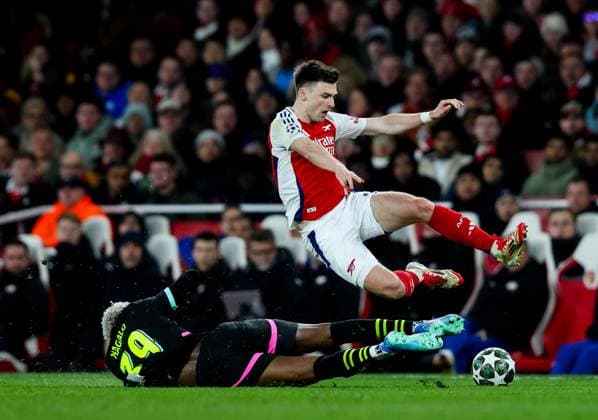 Kieran Tierney of Arsenal tackled by Adamo Nagalo of PSV Eindhoven Arsenal v PSV Eindhoven, UEFA Champions League, Round of 16, Second Leg, Football, Emirates Stadium, London, UK - 12 Mar 2025 EDITORIAL USE ONLY No use with unauthorised audio, video, data, fixture lists, club league logos or live services. Online in-match use limited to 120 images, no video emulation. No use in betting, games or single club league player publications.  Copyright: xAndrewxFosker Shutterstockx 15188185br