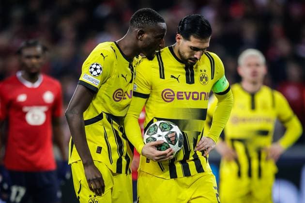 March 12, 2025, Villeneuve-D ascq, France, France: Serhou GUIRASSY of Borussia Dortmund and Emre CAN of Borussia Dortmund during the UEFA Champions League match between Lille OSC (LOSC) and Borussia Dortmund at Pierre Mauroy Stadium on March 12, 2025 in Villeneuve-d Ascq near Lille, France. Villeneuve-D ascq France - ZUMAm308 20250312_zsp_m308_005 Copyright: xMatthieuxMirvillex
