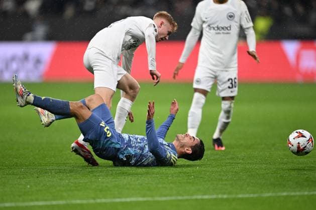 Soccer UEFA Europa League Round of 16 Eintracht Frankfurt Ajax Amsterdam on 13 03 2025 at Deutsche Bank Park in Frankfurt Lucas Rosa Amsterdam , below Hugo Larsson Frankfurt , above xJKx