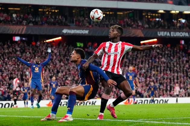Athletic Club v AS Roma - UEFA Europa League 2024 25 Round of 16 Second Leg Nico Williams left winger of Athletic Club and Spain and Devyne Rensch of Roma compete for the ball during the UEFA Europa League 2024 25 Round of 16 Second Leg match between Athletic Club and AS Roma at Estadio de San Mames on March 13, 2025 in Bilbao, Spain. Bilbao Basque Country Spain  Copyright: xJosexBretonx originalFilename:bretonhernandez-athletic250313_npYNP.jpg