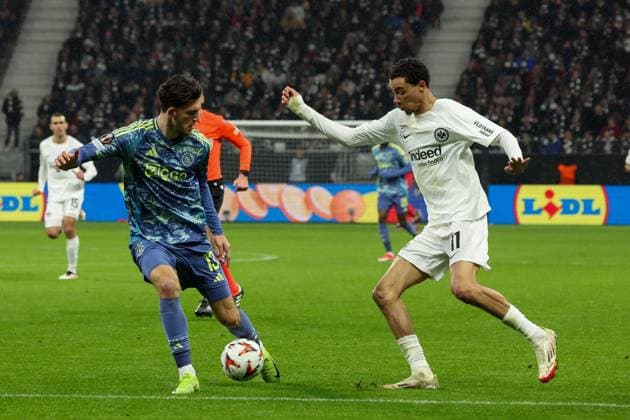 in duel, action, with Hugo Ekitike Eintracht Frankfurt 11 and Ahmetcan Kaplan Ajax Amsterdam 13 out and scores to 3 0, Eintracht Frankfurt vs Ajax Amsterdam, football, UEFA Europa League, round of 16, second leg, 13 03 2025 Frankfurt Hessen Germany Copyright: xkolbert-press MartinxAgüerax