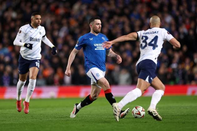 John Souttar of Rangers and Sofyan Amrabat of Fenerbahce during the Europa League last 16 match at Ibrox Stadium, Glasgow. Rangers v Fenerbahce, UEFA Europa League, Round of 16, Second Leg, Football, Ibrox Stadium, Glasgow, Scotland, UK - 13 Mar 2025 EDITORIAL USE ONLY No use with unauthorised audio, video, data, fixture lists, club league logos or live services. Online in-match use limited to 120 images, no video emulation. No use in betting, games or single club league player publications. Copyright: xO Rourke RangersxFC Shutterstockx 15196580p