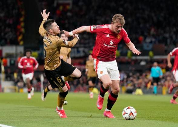 Manchester, England, 13th March 2025. Igor Zubeldia of Real Sociedad tussles with Rasmus Hojlund of Manchester United, ManU during the UEFA Europa League match Manchester United v Real Sociedad at Old Trafford, Manchester. Picture credit should read: Andrew Yates Sportimage EDITORIAL USE ONLY. No use with unauthorised audio, video, data, fixture lists, club league logos or live services. Online in-match use limited to 120 images, no video emulation. No use in betting, games or single club league player publications. SPI_036_AY_MANU_SOCIEDAD SPI-3744-0038
