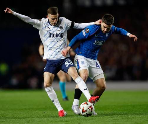 Rangers v Fenerbahce S.K. UEFA Europa League Sebastian Szymanski of Fenerbahe S.K. (left) competes for the ball with Nicolas Raskin of Rangers during the UEFA Europa League Round of 16 Second Leg match at Ibrox Stadium, Glasgow UK Newspapers OUT Copyright: xFredxPalmerx FIL-21575-0032