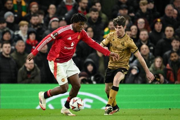 UEFA Europa League Last 16 Manchester United, ManU v Real Sociedad Patrick Dorgu of Manchester United with the ball during the UEFA Europa League Last 16 match Manchester United vs Real Sociedad at Old Trafford, Manchester, United Kingdom, 13th March 2025 (Photo by Craig Thomas News Images) Manchester Old Trafford Greater Manchester United Kingdom Copyright: xCraigxThomas NewsxImagesx