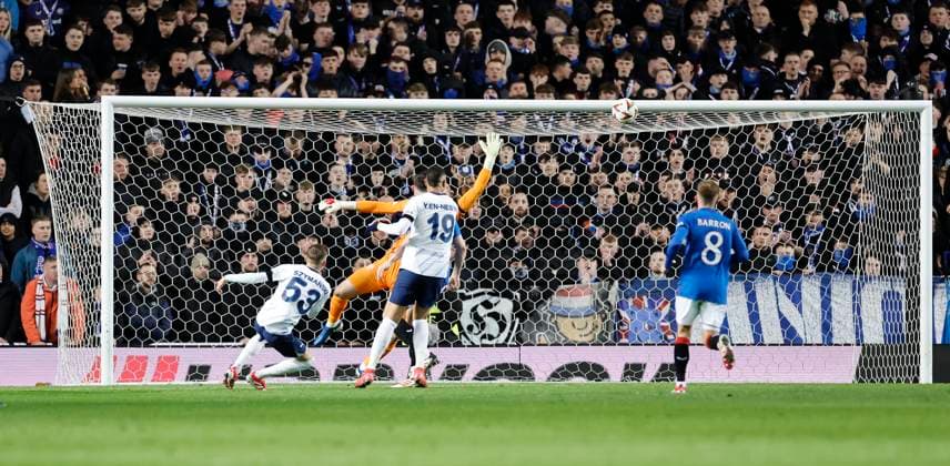 Rangers v Fenerbahce S.K. UEFA Europa League Sebastian Szymanski of Fenerbahe S.K. (left) scores his teams first goal during the UEFA Europa League Round of 16 Second Leg match at Ibrox Stadium, Glasgow UK Newspapers OUT Copyright: xFredxPalmerx FIL-21575-0052