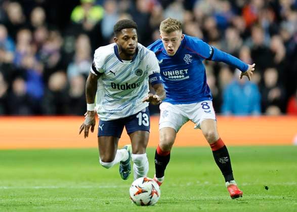 Rangers v Fenerbahce S.K. UEFA Europa League Fred of Fenerbahe S.K. shields the ball from Connor Barron of Rangers during the UEFA Europa League Round of 16 Second Leg match at Ibrox Stadium, Glasgow UK Newspapers OUT Copyright: xFredxPalmerx FIL-21575-0064
