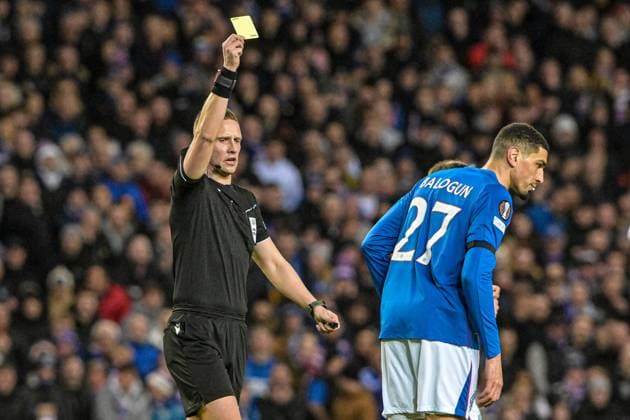 Rangers v Fenerbahce S.K. UEFA Europa League Leon Balogun of Rangers is shown a yellow card during the UEFA Europa League Round of 16 Second Leg match at Ibrox Stadium, Glasgow UK Newspapers OUT Copyright: xJamiexJohnstonx FIL-21576-0019
